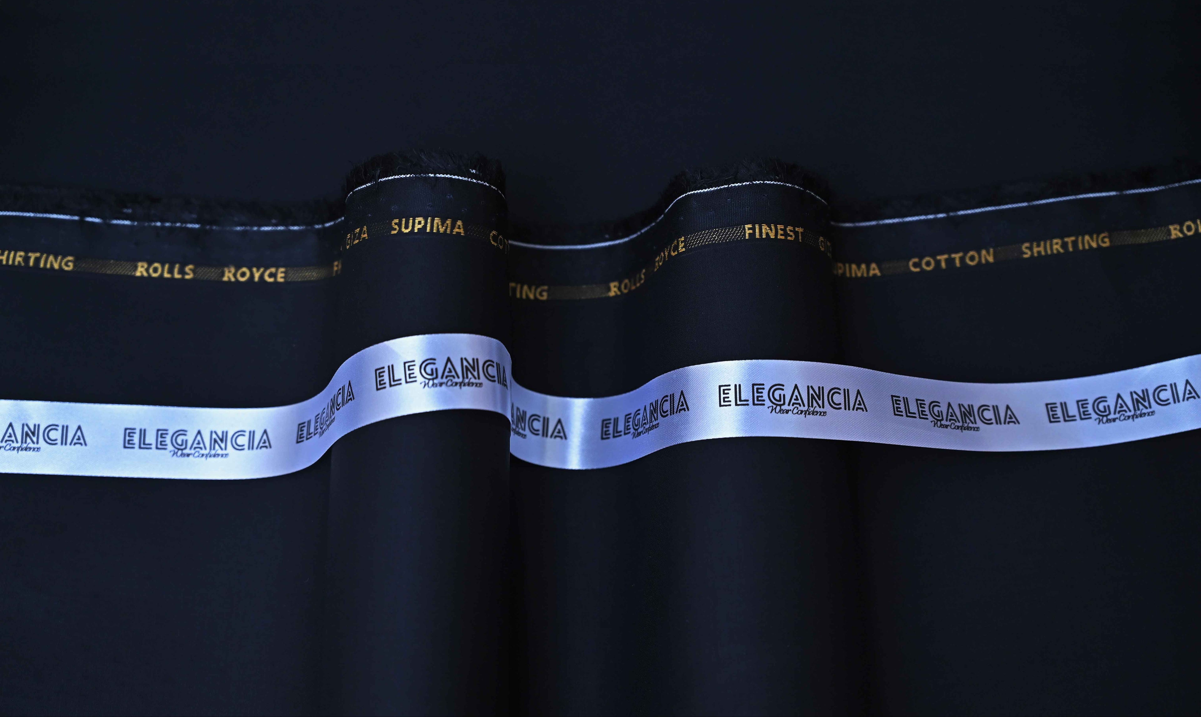 Elegant black ribbon with 'Elegancia' branding on a dark background